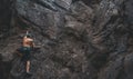 Man climbing on stone rock Royalty Free Stock Photo