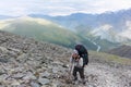 Man climbing the trail on the Pass Kara-Turek, Altai, Russia