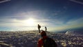 Man Climbing Up Snowy Mountain Ice Axe and Crampons