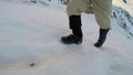 Man Climbing Up Snowy Mountain Ice Axe and Crampons