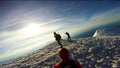 Man Climbing Up Snowy Mountain Ice Axe and Crampons