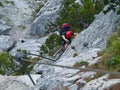 Man climbing on via ferrata Royalty Free Stock Photo