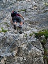 Man climbing on via ferrata Royalty Free Stock Photo