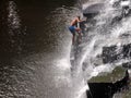 Man climbing waterfalls