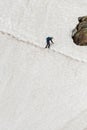 Man Climbs Acros Precarious Snow Trail