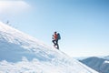 A man climbs to the top of the mountain.