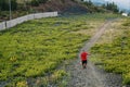 Man climbs uphill along the path Royalty Free Stock Photo