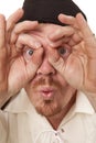 Man close look through hands wide eyes Royalty Free Stock Photo