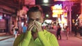 Man close up look caucasian at Pattaya Walking Street with wearing protective medical mask. Lockdown quarantine