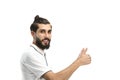 A man, close-up, on a white background, shows his thumbs up Royalty Free Stock Photo