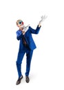 Man in a clown mask and a business suit Royalty Free Stock Photo