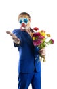 Man in a clown mask holding flowers. Invitation gesture