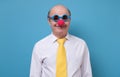 Man in clown nose ready for Firts of April, day of Fool.