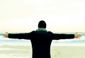 Man in coat with his arms in the air in front of the ocean