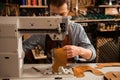Man cobbler stitching leather patrs Royalty Free Stock Photo