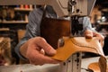 Man cobbler stitching leather patrs Royalty Free Stock Photo