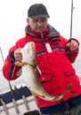 Man with cod fish Royalty Free Stock Photo