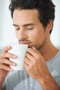 Man, coffee and cup smell for relax drink or morning breakfast beverage, calm daydream on lazy weekend. Male person, mug