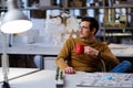 Man with coffee in design and engineering architecture office