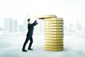 Man with coins tower concept Royalty Free Stock Photo