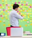 Man collecting his stuff after redundancy in the office with man