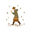 Man collecting mushrooms, walking with basket under the falling autumn leaves