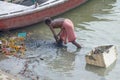 The man collects garbage in the Gang River India