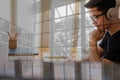 Man college student  studying learning lesson with computer online taking note Royalty Free Stock Photo