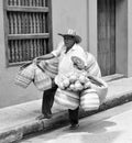 A man in Colombia carrying his baskets