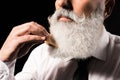 Man combing long beard Royalty Free Stock Photo