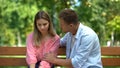 Man comforting disappointed girlfriend, life and health problems, spouse support Royalty Free Stock Photo