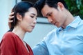 Man comforting his wife and woman hugging her husband and cry in front of the house and full of cardboard boxes during the Royalty Free Stock Photo