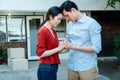 Man comforting his wife and woman hugging her husband and cry in front of the house and full of cardboard boxes during the Royalty Free Stock Photo