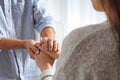Man comforting woman on light background, closeup of hands Royalty Free Stock Photo
