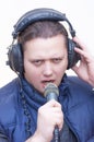 Man commentator with microphone and headphones on his head