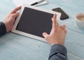 Man communicates using a tablet computer in the morning Royalty Free Stock Photo