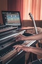 A man composer, producer, arranger, songwriter, musician hands arranging music.