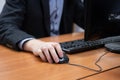 man at the computer, hand on the mouse Royalty Free Stock Photo
