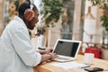 Man computer headphones person laptop business young technology sitting adult online working male communication Royalty Free Stock Photo