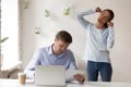 Man concentrated on work near female making funny face Royalty Free Stock Photo