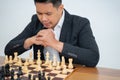 Man concentrates on taking step while playing chess