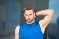 Man confident in his antiperspirant. Sportsman after training pleased with antiperspirant. Guy checks dry armpit