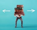 Man with a lot of luggages is confused about the right destination Royalty Free Stock Photo