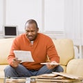 Man constructing wooden shelf