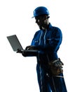 Man construction worker computing computer silhouette portrait Royalty Free Stock Photo