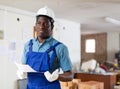 Man construction worker with document inside apartment Royalty Free Stock Photo