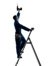 Man construction worker holding drill silhouette