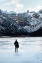 man contemplating snowy mountain in solitude, Ushuaia Laguna Esmeralda