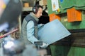Man controlling hydraulic press machine for cutting steel Royalty Free Stock Photo