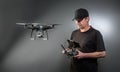 Man controls a quadrocopter. Selective focus on men, drone is blurred